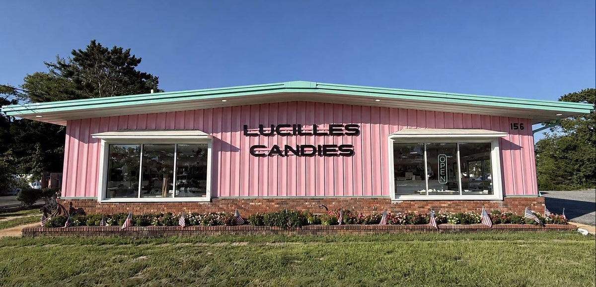 a pink building with a sign on the side